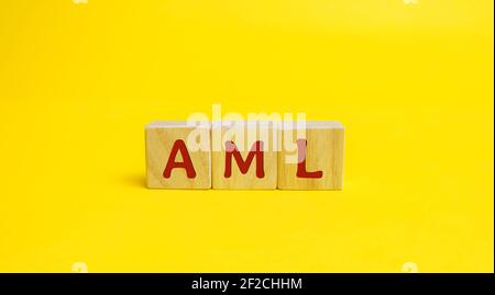 Wooden blocks AML. Anti Money Laundering concept. Financial monitoring, Identification of suspicious transactions. Business and finance. Fight against Stock Photo