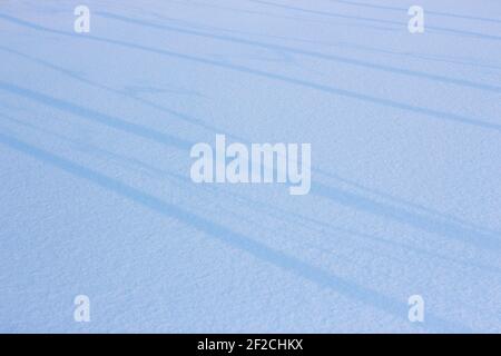 Snow background, white blanket and lines with shadows Stock Photo