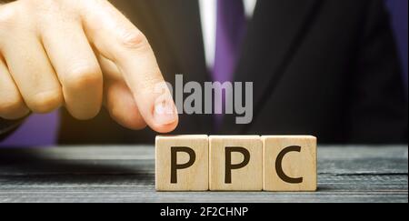 Wooden blocks with the word PPC. Internet advertising model used to drive traffic to websites. Internet marketing concept, social media marketing. Sea Stock Photo