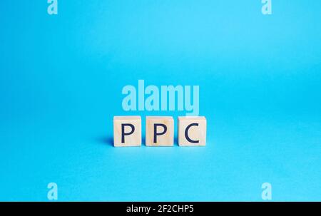 Wooden blocks with the word PPC. Internet advertising model used to drive traffic to websites. Internet marketing concept, social media marketing. Sea Stock Photo