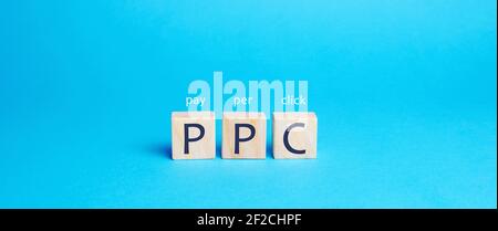 Wooden blocks with the word PPC. Internet advertising model used to drive traffic to websites. Internet marketing concept, social media marketing. Sea Stock Photo