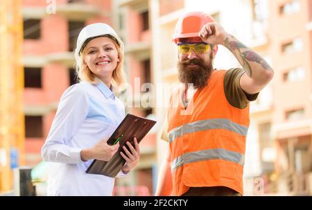 Construction industry. Foreman established supply of building materials. Expert and builder communicate about supply building materials. Successful deal concept. Purchase of building materials. Stock Photo