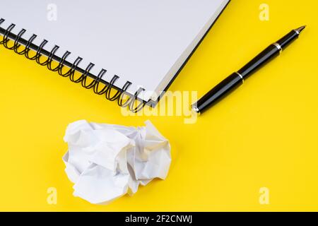 a pen and a crumpled sheet of paper Stock Photo