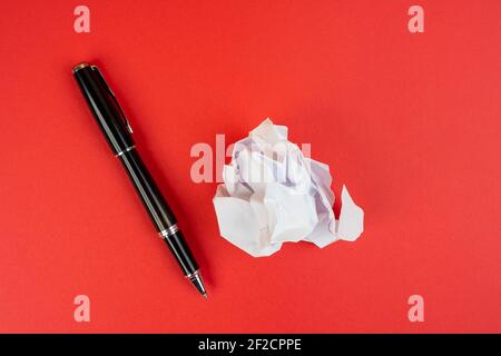 a pen and a crumpled sheet of paper Stock Photo