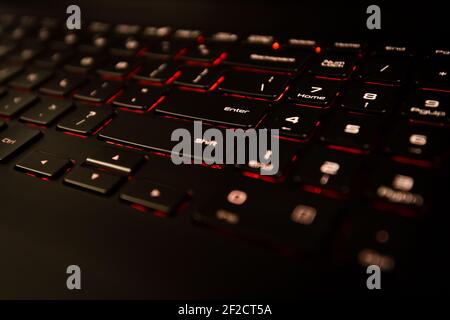 Black Laptop Computer Keyboard With Illuminated Red Backlight Stock Photo
