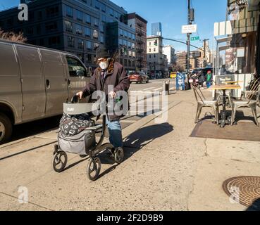 NEW YORK, NEW YORK - FEBRUARY 24: Woman with a Ukrainian flag poses ...