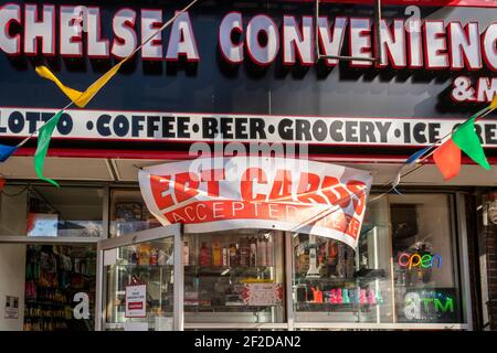 A convenience store in the Chelsea neighborhood of New York advertises its acceptance of EBT cards on Thursday, March 4, 2021. (© Richard B. Levine) Stock Photo