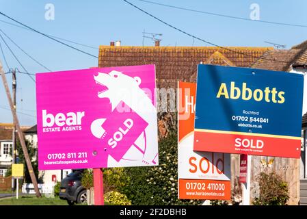 Sold properties. Quantity of estate agency sold boards in Great Stambridge village, Essex, UK. Abbotts, Bear estate agents Stock Photo