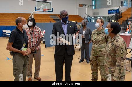 U.S. Virgin Islands Governor Albert Bryan Jr., center, speaks with interagency leadership about daily operations at the territorially-led, federally-supported COVID-19 Community Vaccination Center March 11, 2021 in St. Thomas, U.S Virgin Islands. Credit: Planetpix/Alamy Live News Stock Photo