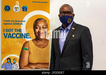 U.S. Virgin Islands Governor Albert Bryan Jr., poses in front of the post-vaccination selfie station at the territorially-led, federally-supported COVID-19 Community Vaccination Center March 11, 2021 in St. Thomas, U.S Virgin Islands. Credit: Planetpix/Alamy Live News Stock Photo