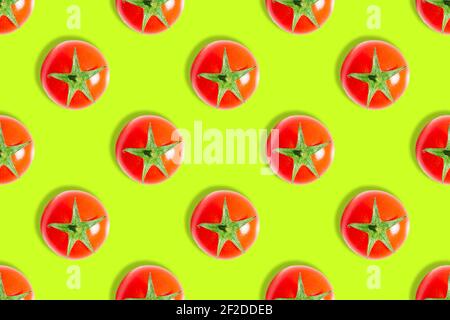 Seamless vegetable pattern of fresh ripe cherry tomatoes isolated on green background. Top view. Banner. Flat lay composition. Stock Photo