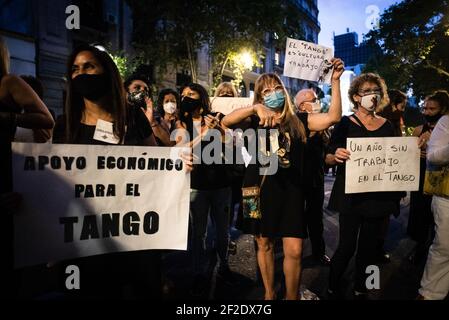 Buenos Aires, Argentina. 11th Mar, 2021. Workers hold placards during the demonstration. Tango workers gathered at the doors of the Ministry of Culture to ask for the resumption of activity in the City of Buenos Aires and show that they have been unable to work for a year. Credit: SOPA Images Limited/Alamy Live News Stock Photo
