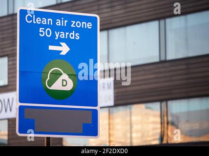 A sign pointing to the Clean Air Zone, Birmingham's pollution charge initiative, is covered in gray tape as the scheme is postponed to Summer 2021