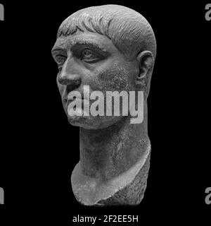 Head detail of the ancient man sculpture. Stone face isolated on black background. Antique marble statue of mythical hero character Stock Photo