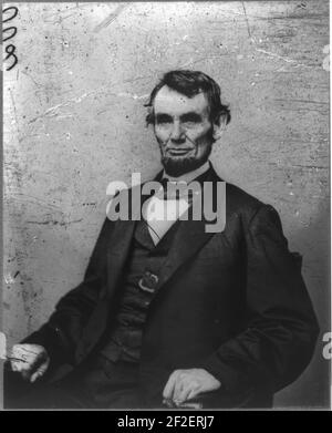 President Abraham Lincoln, three-quarter length portrait, seated, facing left Stock Photo