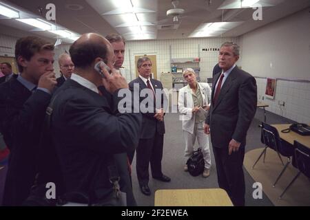 President George W. Bush Confers with Staff Members. Stock Photo