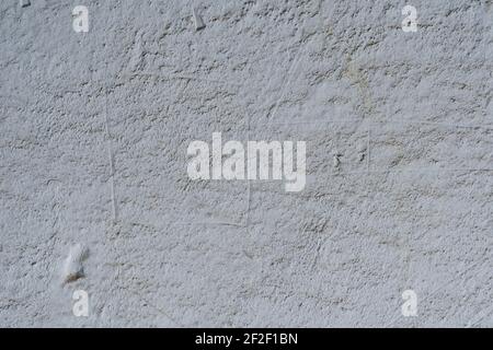 Dusty gray cement wall with irregularities. Old painted wall. Abstract textured background. Stock Photo