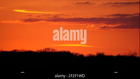 Sunset over fields in North Rhine Westphalia in winter Stock Photo