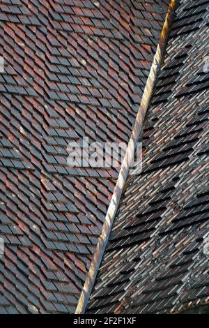 Rectangular wooden roof tiles shingles on old conservation building Stock Photo
