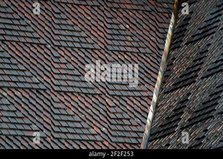 Rectangular wooden roof tiles shingles on old conservation building Stock Photo