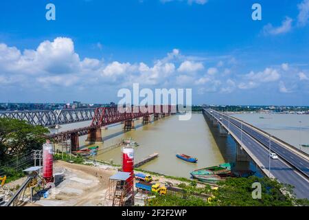 Aerial photo of Syed Nazrul Islam Bridge and two rail way bridges cross the Meghna River from Bhairab Bazar to Ashuganj. Bangladesh. Stock Photo