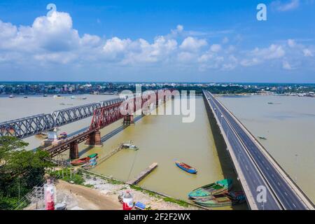 Aerial photo of Syed Nazrul Islam Bridge and two rail way bridges cross the Meghna River from Bhairab Bazar to Ashuganj. Bangladesh. Stock Photo