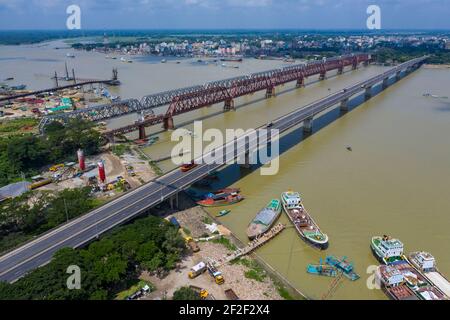 Aerial photo of Syed Nazrul Islam Bridge and two rail way bridges cross the Meghna River from Bhairab Bazar to Ashuganj. Bangladesh. Stock Photo