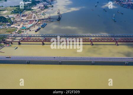 Aerial photo of Syed Nazrul Islam Bridge and two rail way bridges cross the Meghna River from Bhairab Bazar to Ashuganj. Bangladesh. Stock Photo