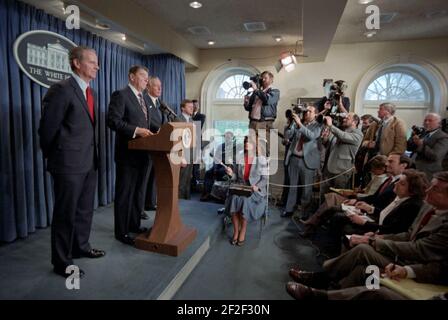 President Ronald Reagan making a statement to the press announcing the nomination of James Baker to be Secretary of the Treasury and the appointment of Donald Regan as Chief of Staff in the Press Briefing Room. Stock Photo