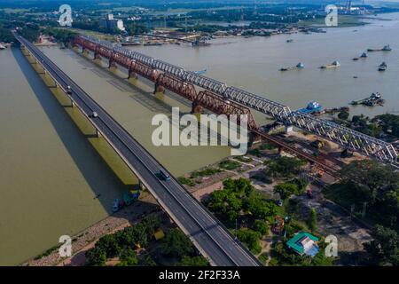 Aerial photo of Syed Nazrul Islam Bridge and two rail way bridges cross the Meghna River from Bhairab Bazar to Ashuganj. Bangladesh. Stock Photo