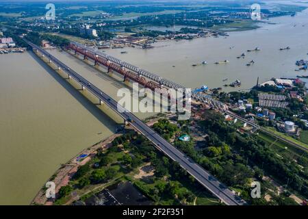 Aerial photo of Syed Nazrul Islam Bridge and two rail way bridges cross the Meghna River from Bhairab Bazar to Ashuganj. Bangladesh. Stock Photo