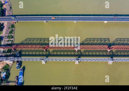 Aerial photo of Syed Nazrul Islam Bridge and two rail way bridges cross the Meghna River from Bhairab Bazar to Ashuganj. Bangladesh. Stock Photo