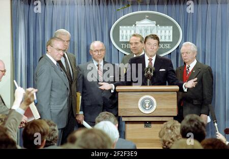 President Ronald Reagan speaking at a podium during his final press ...