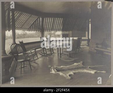President Roosevelt's country home, Sagamore Hill in Oyster Bay, New York, view of porch with mountain lion skin on floor Stock Photo