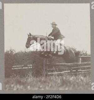 President Theodore Roosevelt on horseback, jumping over a fence Stock Photo