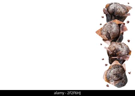Chocolate muffins or cupcakes on white background. Copy space. Stock Photo