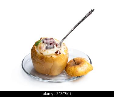 Baked  apples stuffed with soft cheese and nuts isolated on white Stock Photo