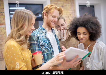 Group of young professionals working on the project together Stock Photo