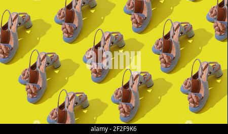 Seamless pattern stylish womens high heel shoes on a trendy yellow background. Fashion concept Stock Photo