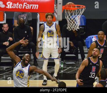 Los Angeles, United States. 12th Mar, 2021. Golden State Warriors' forward Draymond Green scores on Los Angeles Clippers' forward Nicolas Batum during the second half at Staples Center in Los Angeles on Thursday, March 11, 2021. The Clippers defeated the Warriors 130-104. Photo by Jim Ruymen/UPI Credit: UPI/Alamy Live News Stock Photo