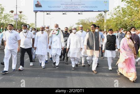 Jaipur, Rajasthan, India, March 12, 2021: Rajasthan Chief Minister Ashok Gehlot along with ministers and congress party workers participates in 'Padyatra' to mark the 91st anniversary of Dandi March or Salt Movement, at Gandhi Circle in Jaipur. On that day in 1930, the iconic Dandi March led by Mahatma Gandhi began. The Salt Movement, which took place from March to April 1930, was an act of civil disobedience led by Mahatma Gandhi to protest against British rule in the country. Credit: Sumit Saraswat/Alamy Live News Stock Photo