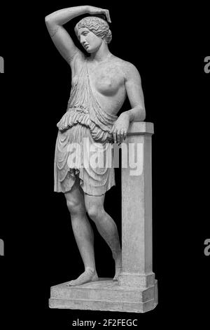 Ancient marble statue of a wounded amazon. Woman antique sculpture isolated on black background Stock Photo