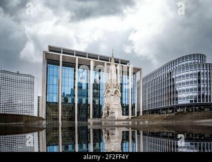 Birmingham City, England Paradise Island new modern class buildings Alpha Tower monument reflected in calm water on ground mirror image regeneration Stock Photo