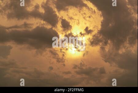 Colorful rain clouds at dusk. Rain-forming clouds. Sunset in the skies of Latin America. Phenomena of nature. Natural watercolors of weather phenomena Stock Photo