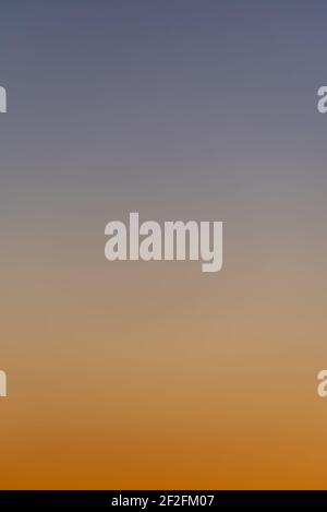 Blue and orange gradient of a sunset sky Stock Photo