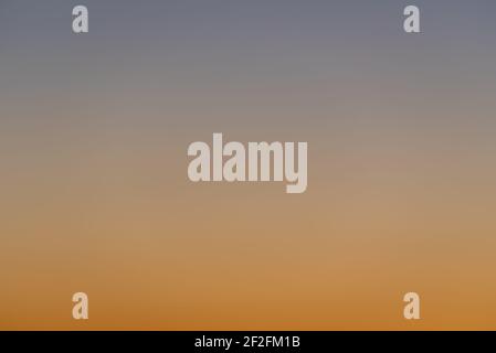 Blue and orange gradient of a sunset sky Stock Photo