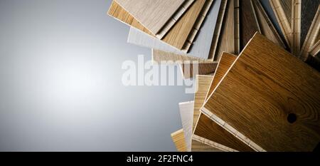 wooden texture flooring material samples on gray background. banner copy space Stock Photo