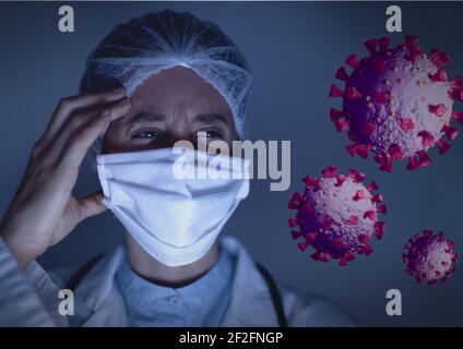 Multiple covid-19 cells against female doctor wearing face mask holding her head Stock Photo