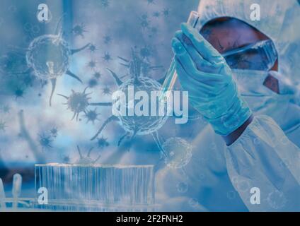 Multiple covid-19 cells against female health worker wearing face mask working in the laboratory Stock Photo