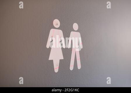 Closeup of a male and female bathroom sign at a school Stock Photo
